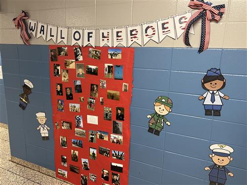 wall of heroes photos at Madison Elementary